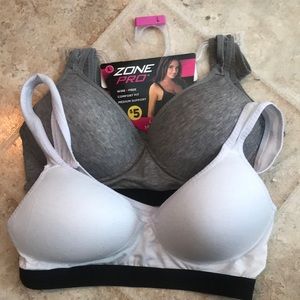 Ladies sports bras; one white one gray both size L. New, original price $5 each